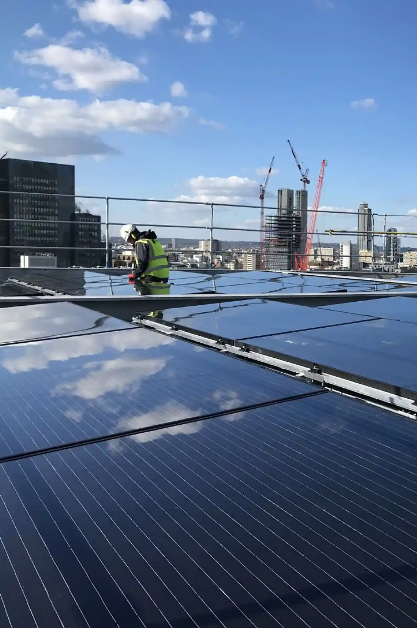 Solar panels being installed on the roof of the London Fruit and Wool Exchange